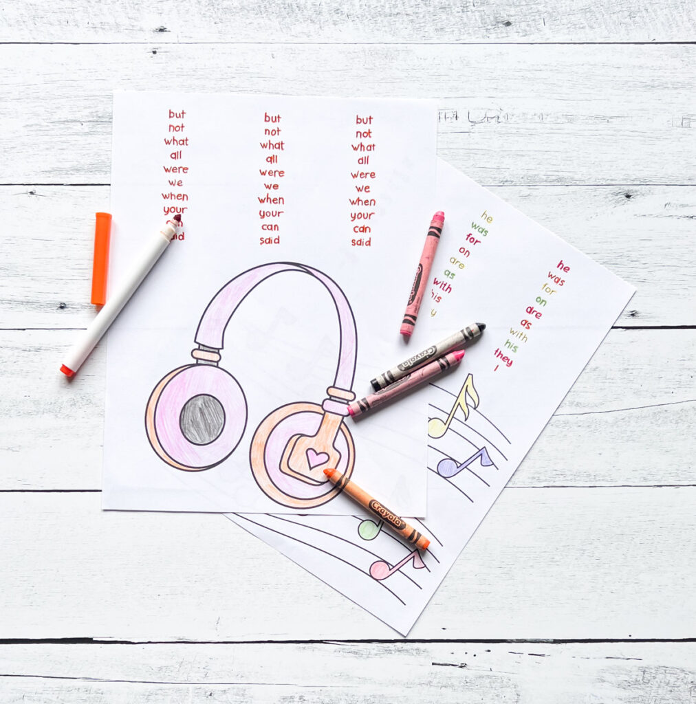 Page with picture of headphones for kids to color and sight words to trace. Markers and crayons lay on the pages.