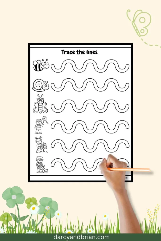 One page with wavy line paths coming out from cute images. A child's hand holding a pencil over the practice sheet.