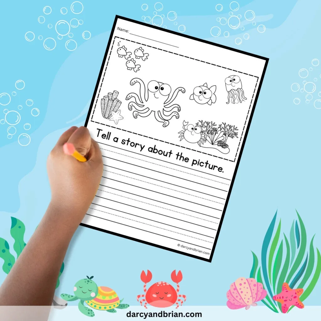 Worksheet with ocean animals to color and writing lines to tell a story about the picture.