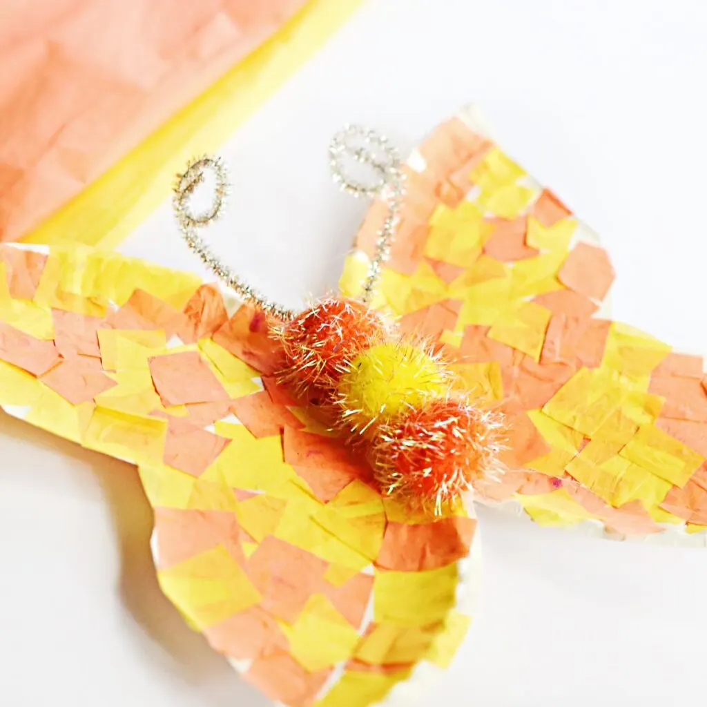 Side angle view of easy paper plate butterfly craft. 