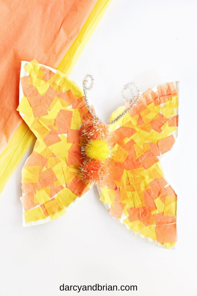 Orange and yellow tissue paper used to create a butterfly craft out of paper plates.