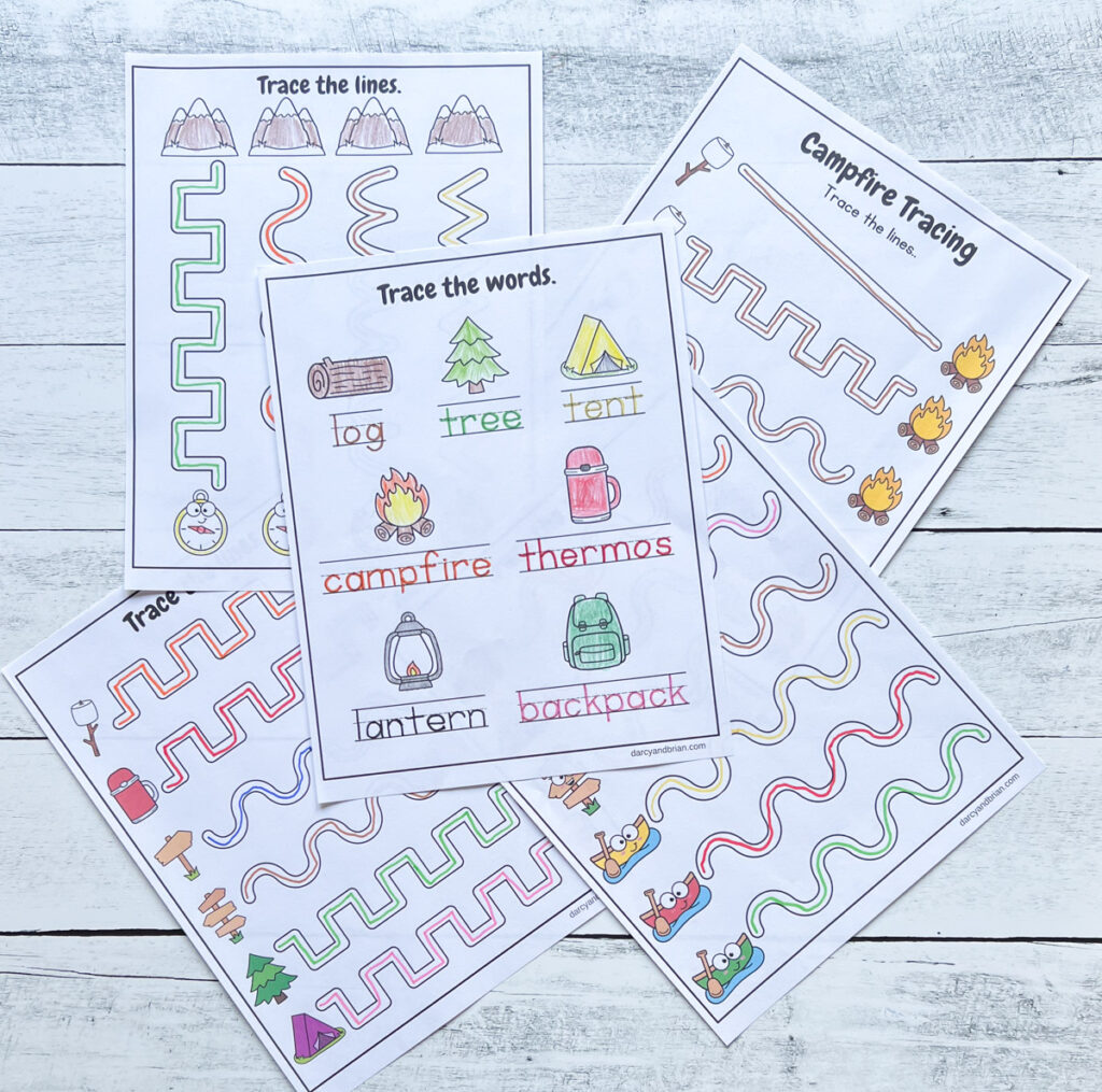 All five campfire and camping worksheets to trace printed out and filled in with colorful markers.