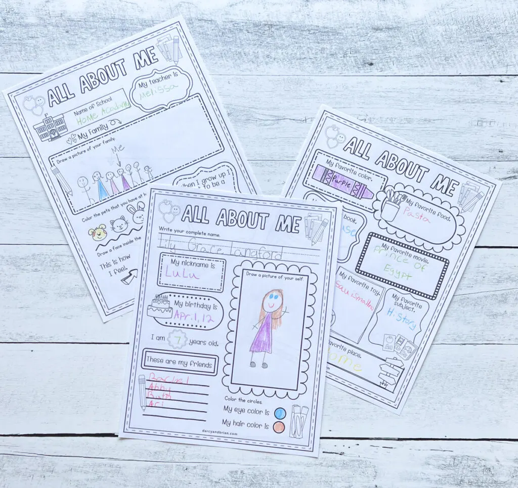 Three worksheets overlapping on a table for a fun "all about me" activity for kids. Top one features a child's self portrait.