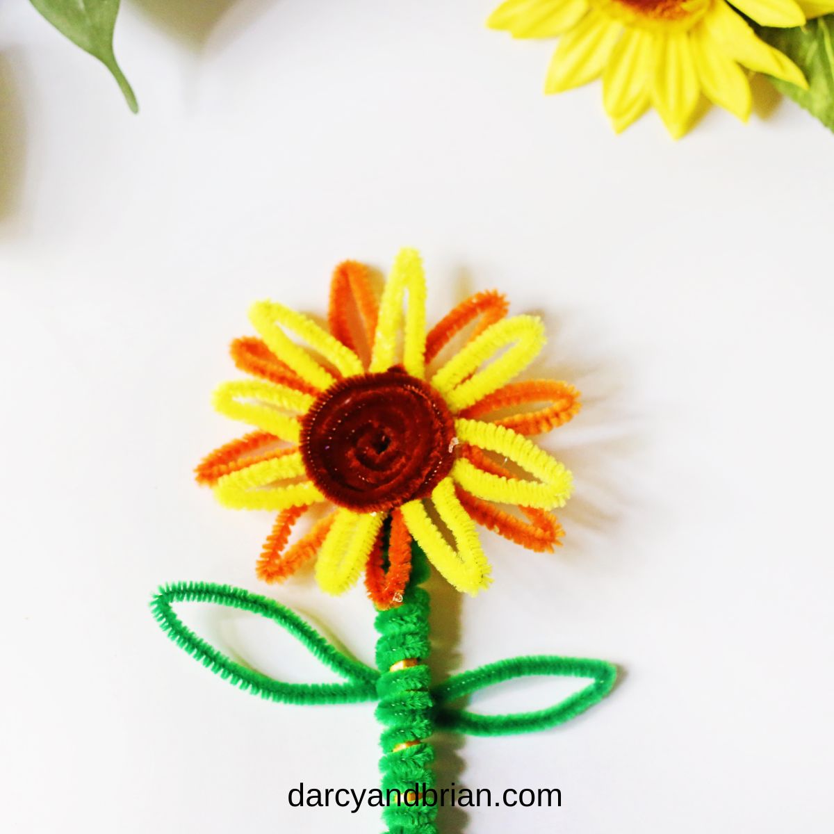 Close up view of finished sunflower craft using chenille stems.