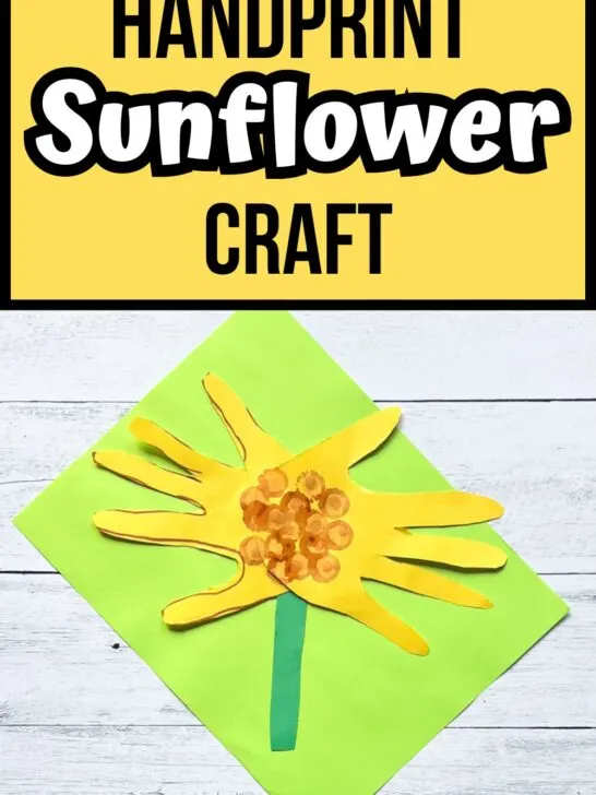 Black and white text on yellow background at the top says Handprint Sunflower Craft. A sunflower made using construction paper and tracing hands for petals laying on bright green paper.