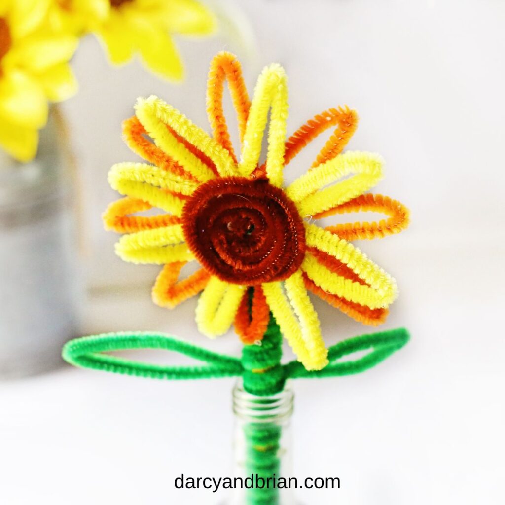 Close up of completed pipe cleaner sunflower craft for kids.