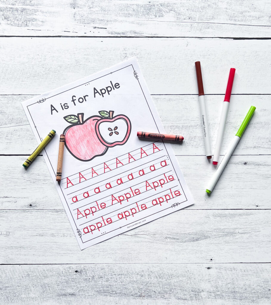 Worksheet with A is for Apple written at the top. Picture of an apple colored red with crayon. Upper and lowercase Aa and the word "apple" traced with red marker.