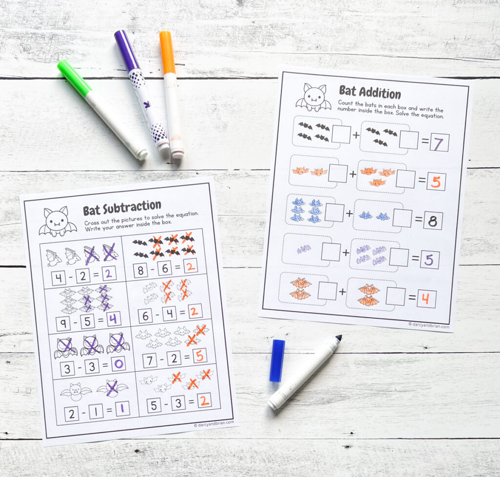 Completed worksheets subtracting bats and one with adding them. They are filled in with colorful markers and colored pencils.