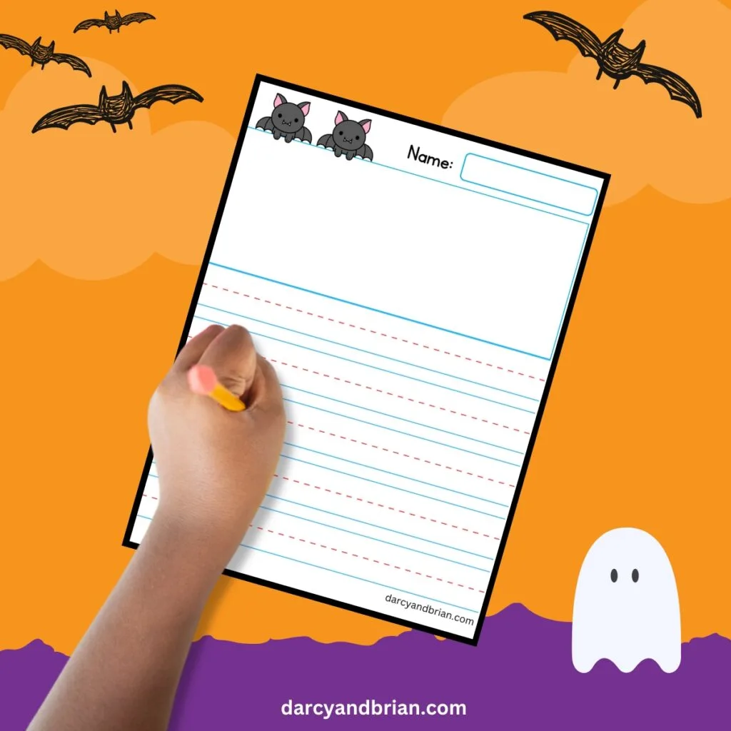 Writing page with purple and orange bat-themed background with a hand holding a pencil to write.