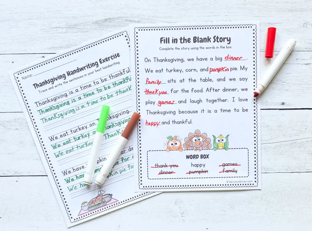 Two writing activity pages about Thanksgiving dinner are filled in with red and gree marker. One is a fill in the blank story and the other is practicing writing sentences.