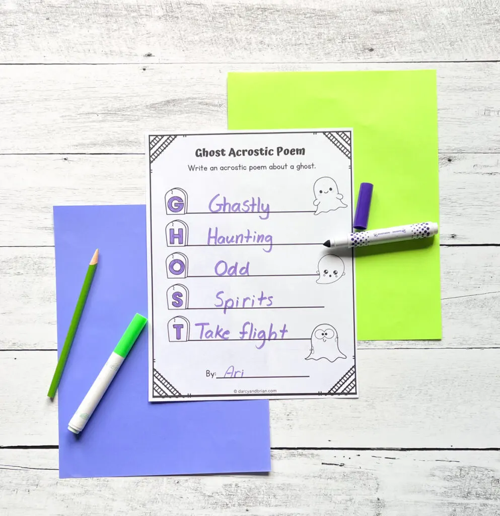 One page worksheet that shows how to do the acrostic poem with the word GHOST. It comes with a blue and green construction paper in a wood background.