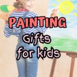 Child wearing striped shirt, overalls, and a red beret standing in front of an easel painting. Text overlay says Painting Gifts for Kids.