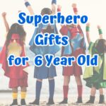 Blue text says Superhero Gifts for 6 Year Old over a picture of four children wearing capes and raising their hands in the air while standing on the beach.