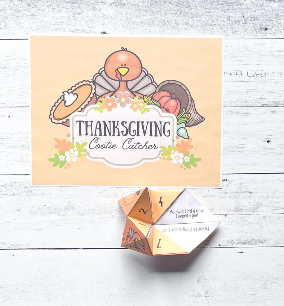 It has a page of the Thanksgiving Cootie Catcher cover page and the assembled fortune teller paper.