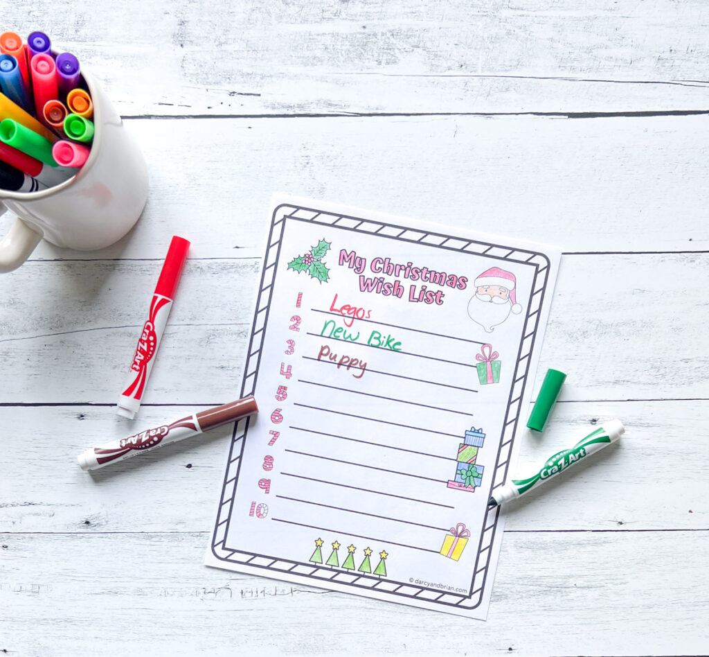 A page of worksheet where kids write sample wishes such as Legos, New bike, or Puppy for Christmas, along with some markers on the background.